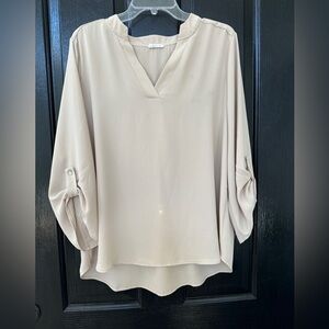 Women’s blouse size large gently worn in excellent condition light beige color